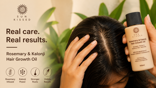 Woman applying hair growth oil directly to her scalp along a section parting